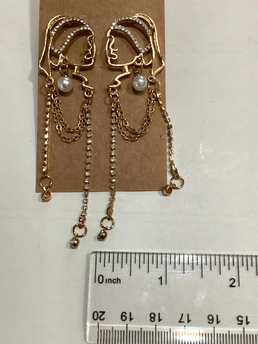 Gold Face Outline Drop Earrings with Pearl and Chain Accents